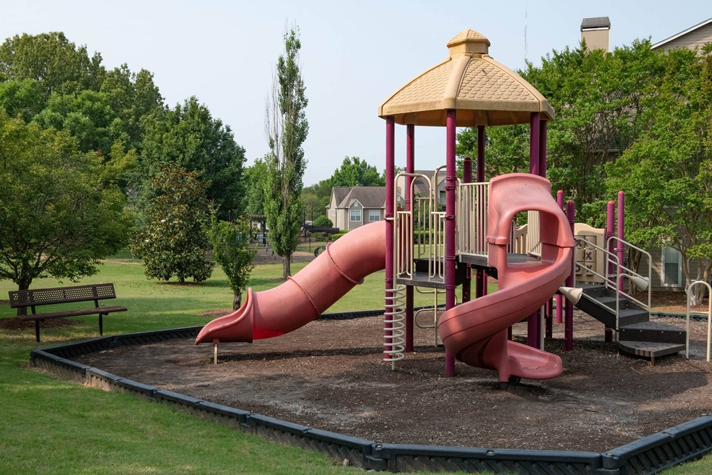 a playground with a pink slide and a wooden gazebo at Appling Lakes, Cordova, 38016