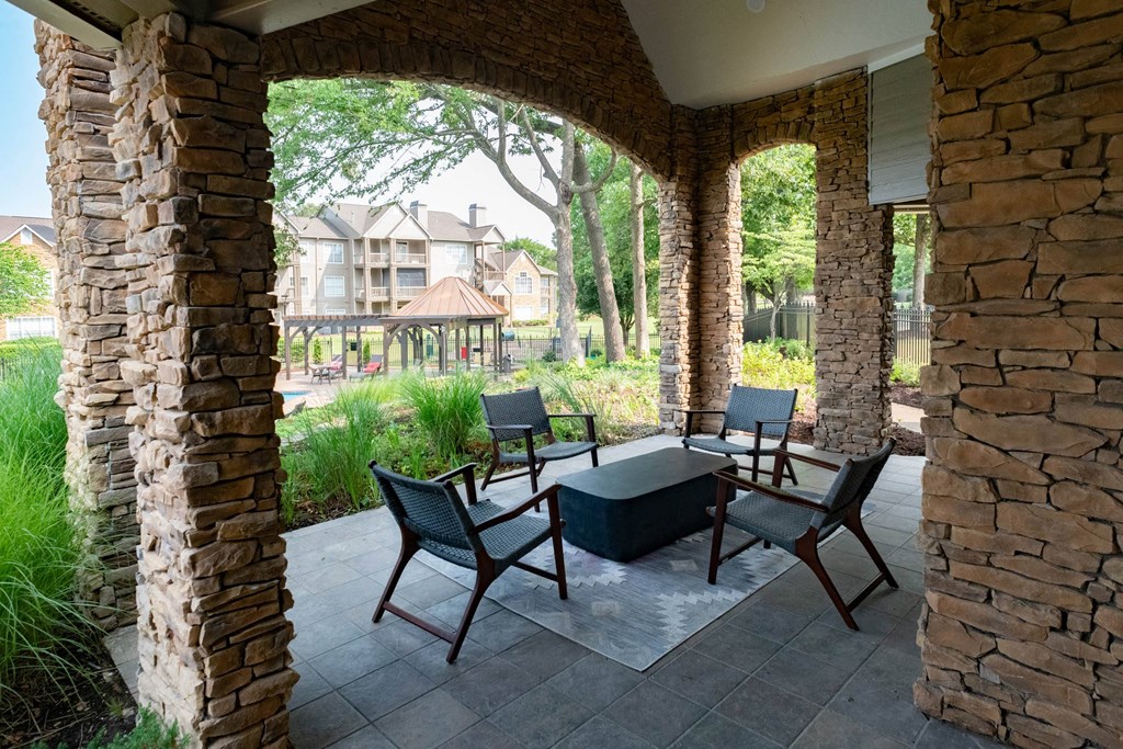 a patio with a table and chairs and a gazebo in the background at Appling Lakes, Cordova, TN, 38016