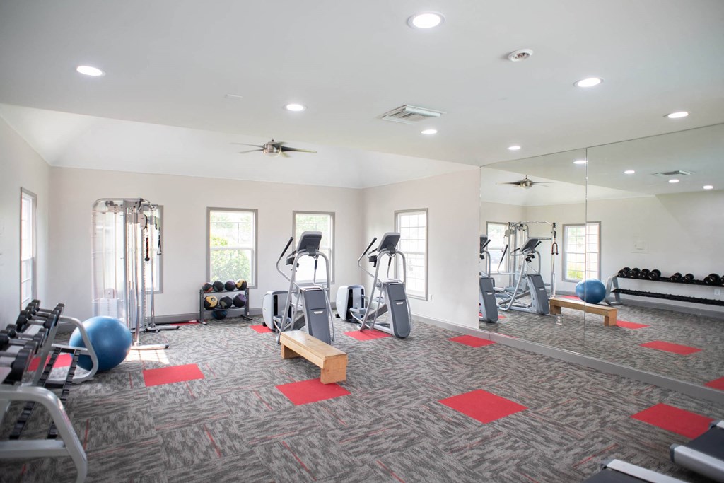 a spacious fitness center with treadmills and other exercise equipment at Appling Lakes, Cordova