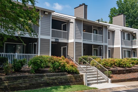 an apartment building with stairs and balconies at 1900 Rosemont, Roswell