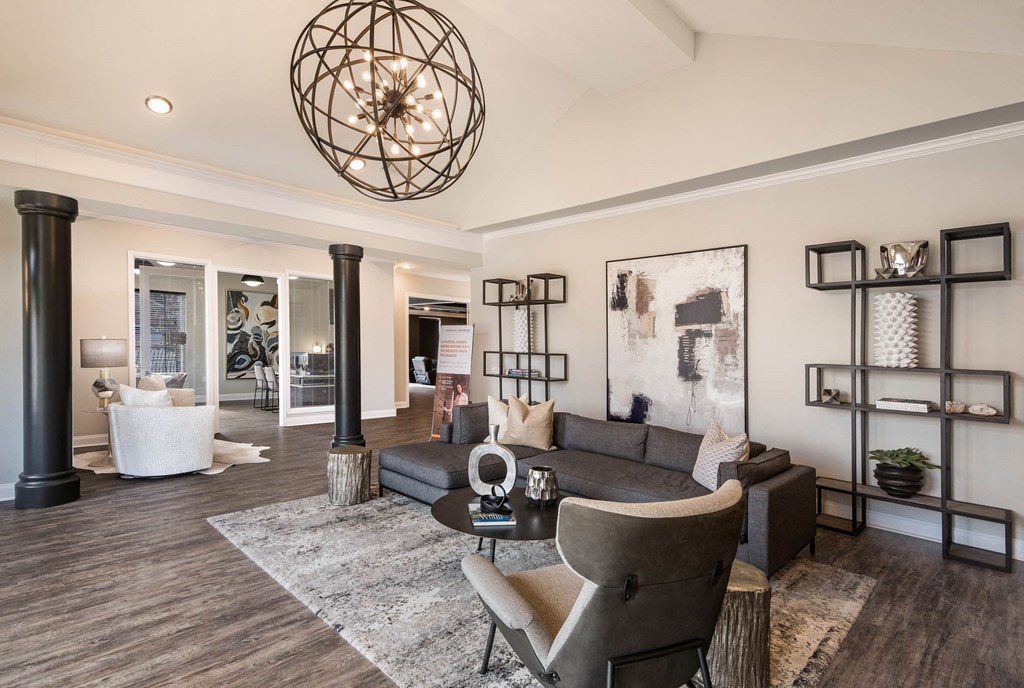 a living room with a couch and a table at Arlo Luxury homes Apartments, Little Rock, AR