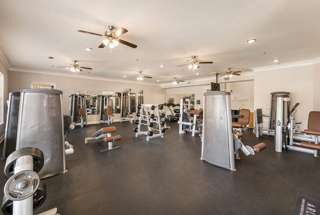 the gym has a variety of weights and cardio equipment at Arlo Luxury homes Apartments, Little Rock