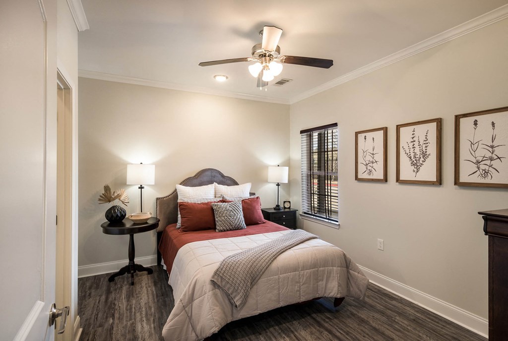 a bedroom with a bed and a ceiling fan  at Arlo Luxury homes Apartments, Little Rock, AR