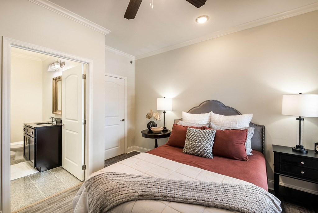 a bedroom with a bed and a closet  at Arlo Luxury homes Apartments, Little Rock, AR,72210