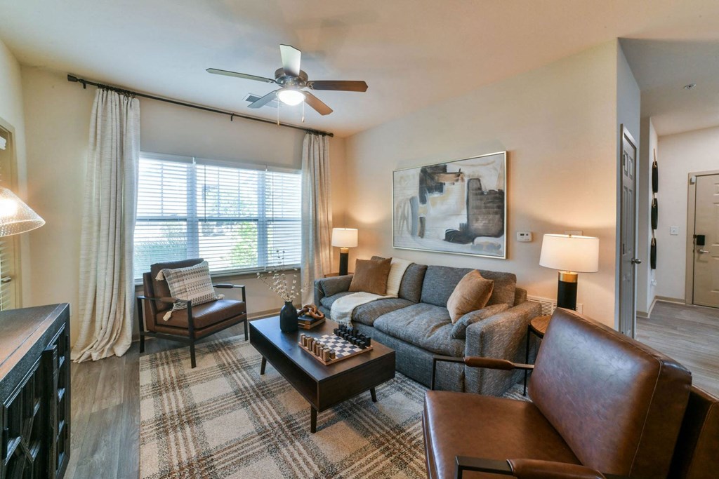 Gorgeous Modern Living Room with Wood Plank Vinyl Flooring (in Select Units) at Ashby at Ross Bridge, Hoover