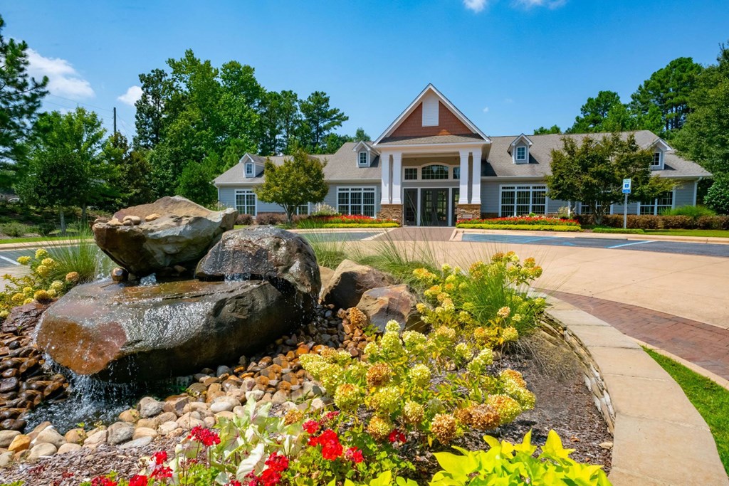 Lush landscaping surrounds you as you drive at Ashby at Ross Bridge, Hoover
