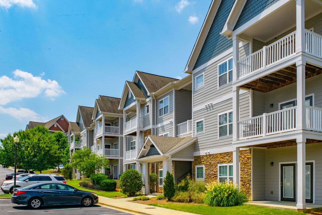 Bright Apartment Home Exteriors with Trees Inviting You Inside at Ashby at Ross Bridge, Hoover, AL