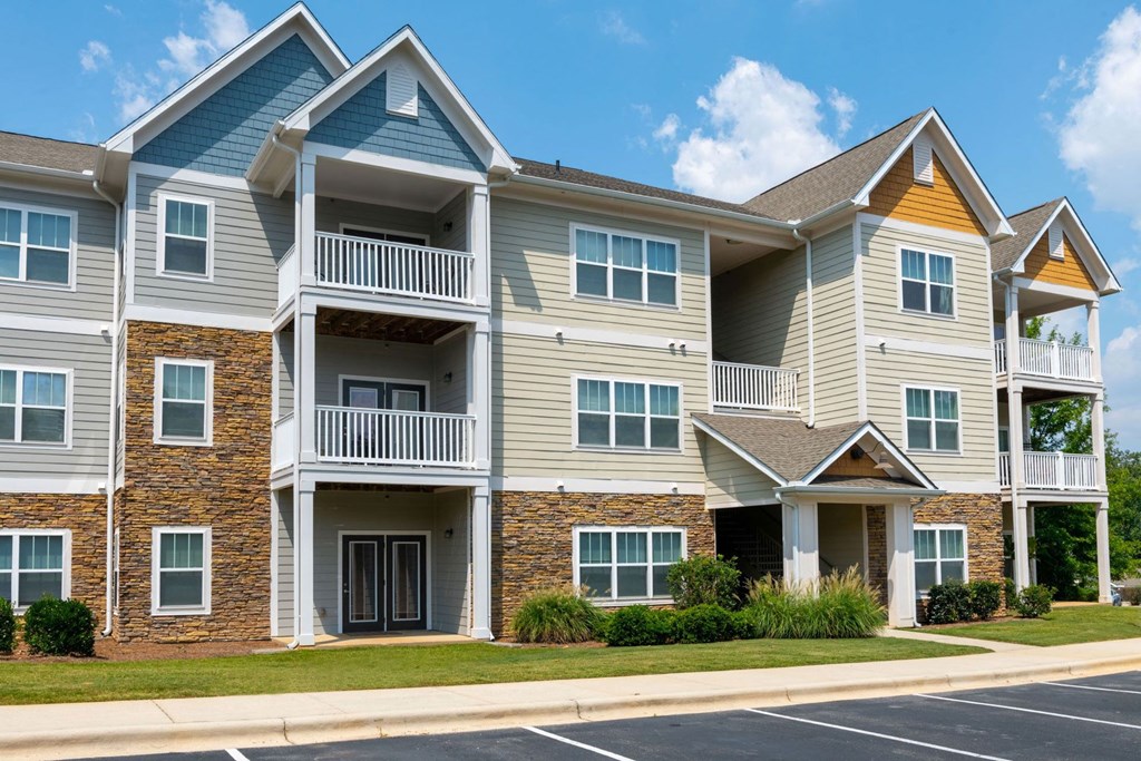 Bright Apartment Home Exteriors with Trees Inviting You Inside at Ashby at Ross Bridge, Hoover, AL 35226