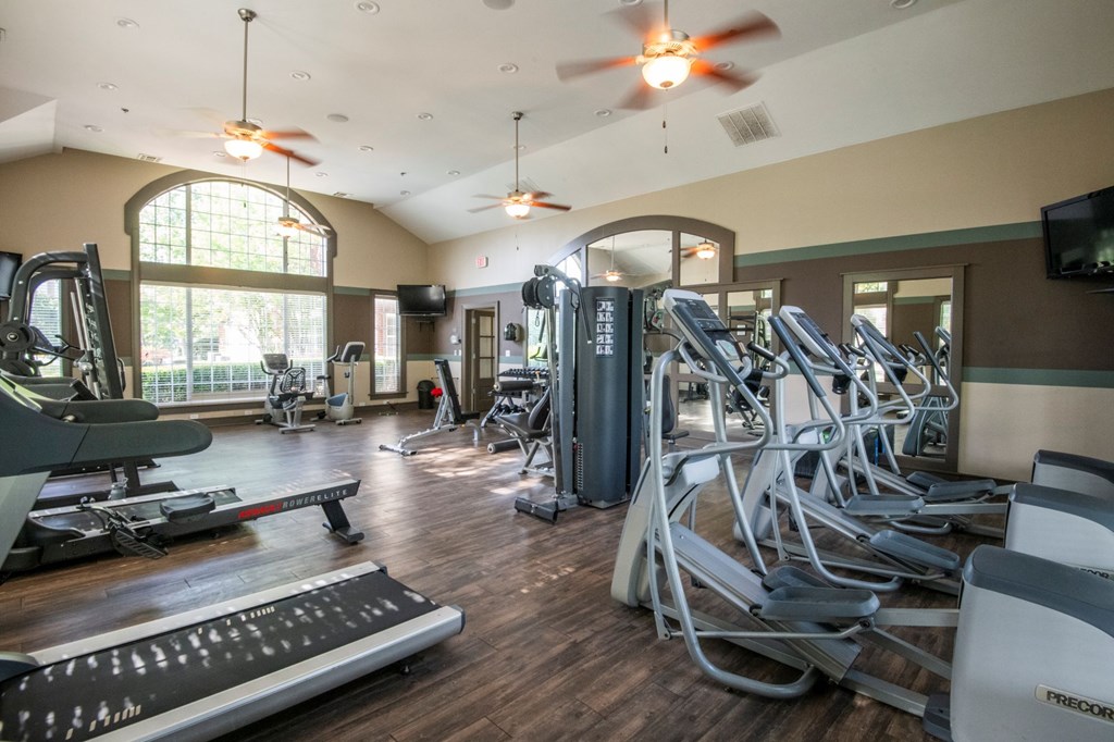 A gym with treadmills, elliptical machines, and other exercise equipment. at Cambridge Square, Overland Park, KS, 66211