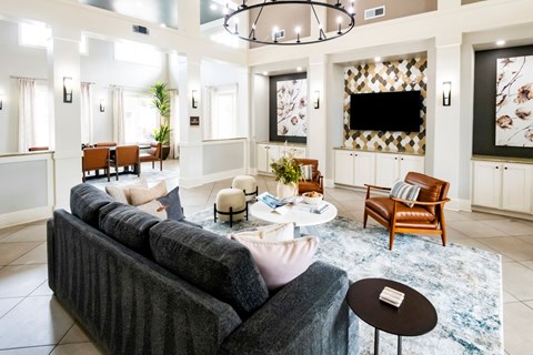 A living room with a grey couch and a coffee table.