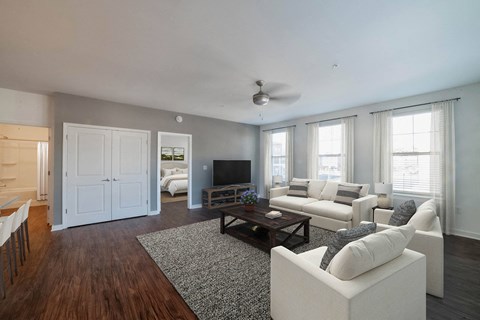A living room with a white couch and a television. at Lakeland Town Square, Tennessee