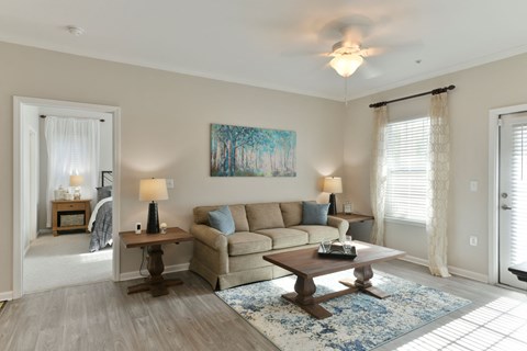 a living room with a couch and a coffee table at Legends at Chatham, Georgia, 31405