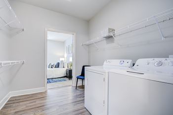 A laundry room with a washer and dryer.