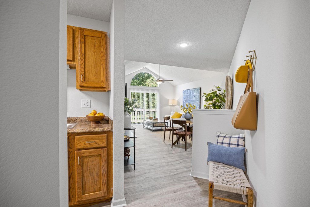 A kitchen with wooden cabinets at Pointe Royal, Kansas, 66213