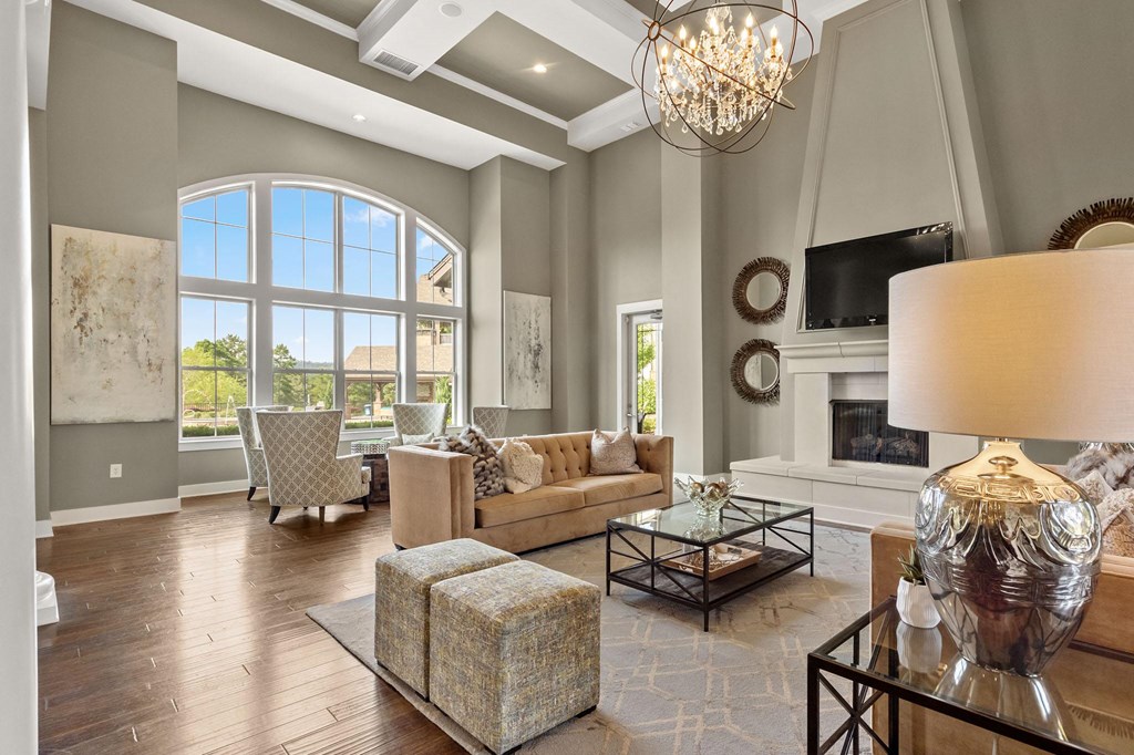 the living room has a fireplace and a large window at The Ridge at Chenal Valley, Little Rock, 72223