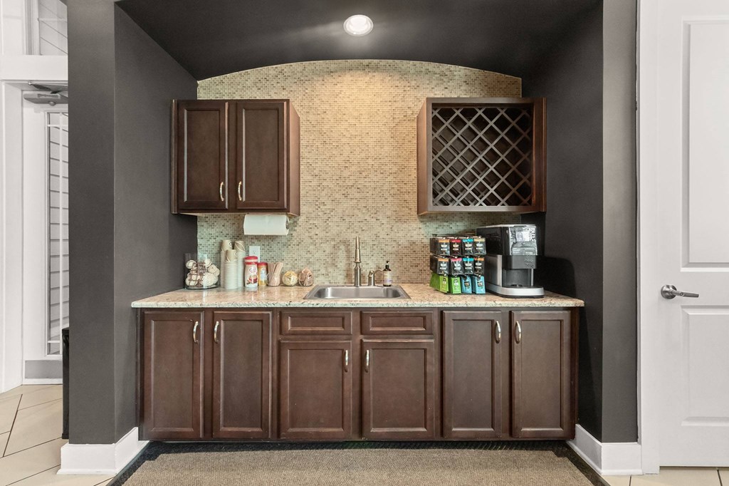 a rendering of a kitchen with brown cabinets and a counter at The Ridge at Chenal Valley, Arkansas