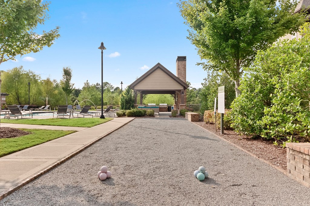 a pathway leading to a pavilion with balls on the ground at The Ridge at Chenal Valley, Little Rock, 72223