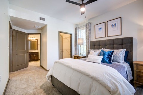 Bedroom with a large bed at The Ridge at Chenal Valley Apartments, Little Rock, 72223