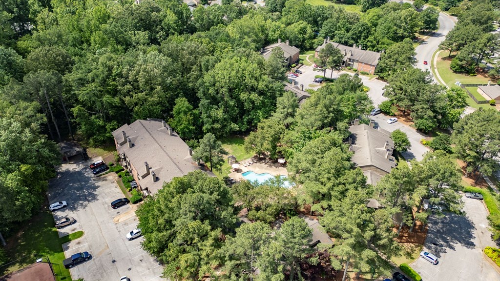 a aerial view of a neighborhood with houses and a swimming pool at The Summit Apartments, Tennessee, 38128