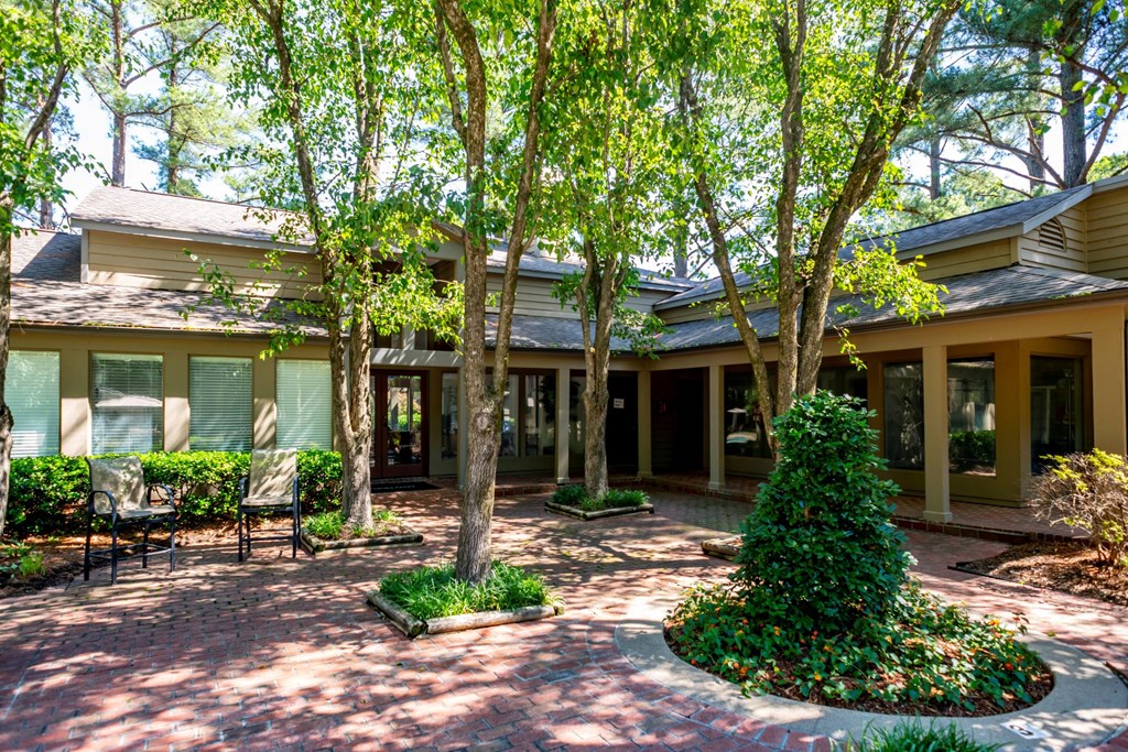 the front of a house with trees and a courtyard at The Summit Apartments, Tennessee