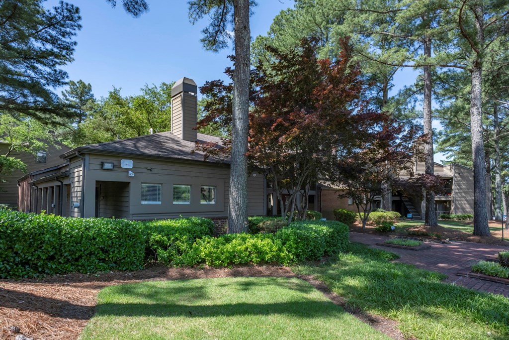 the front of a house with a lawn and trees at The Summit Apartments, Tennessee, 38128