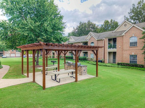 Wooden pergola with benches at The Vineyards Apartments, Germantown