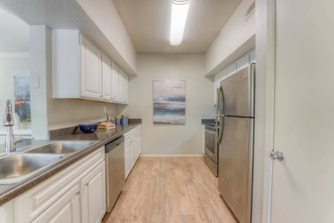 Kitchen with white cabinets at The Vineyards Apartments, Germantown, TN, 38138