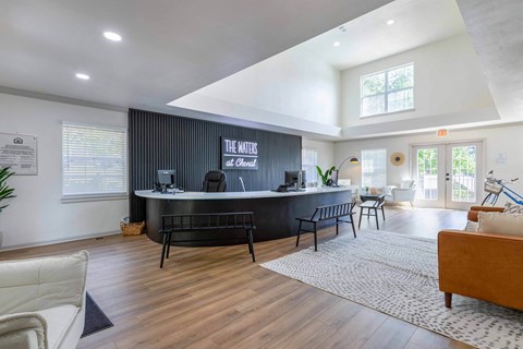 the living room has a large bar and a couch