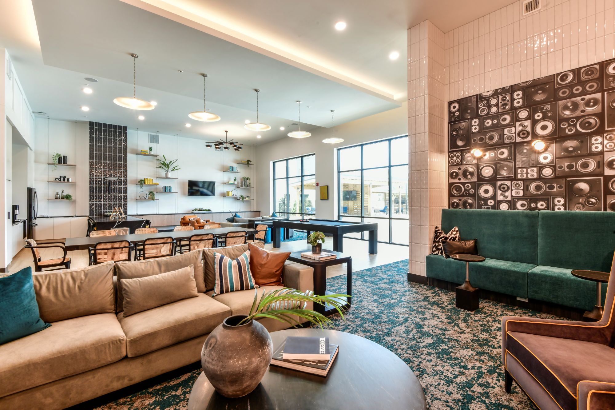 A living room with a green couch and a coffee table.