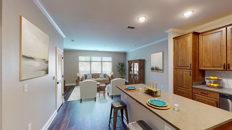 A kitchen with a dining table and chairs in the middle of the room.