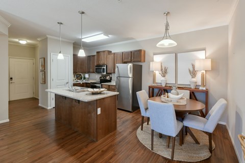 A kitchen with a dining table and chairs. at Hall Creek Apartment Homes, Tennessee, 38002