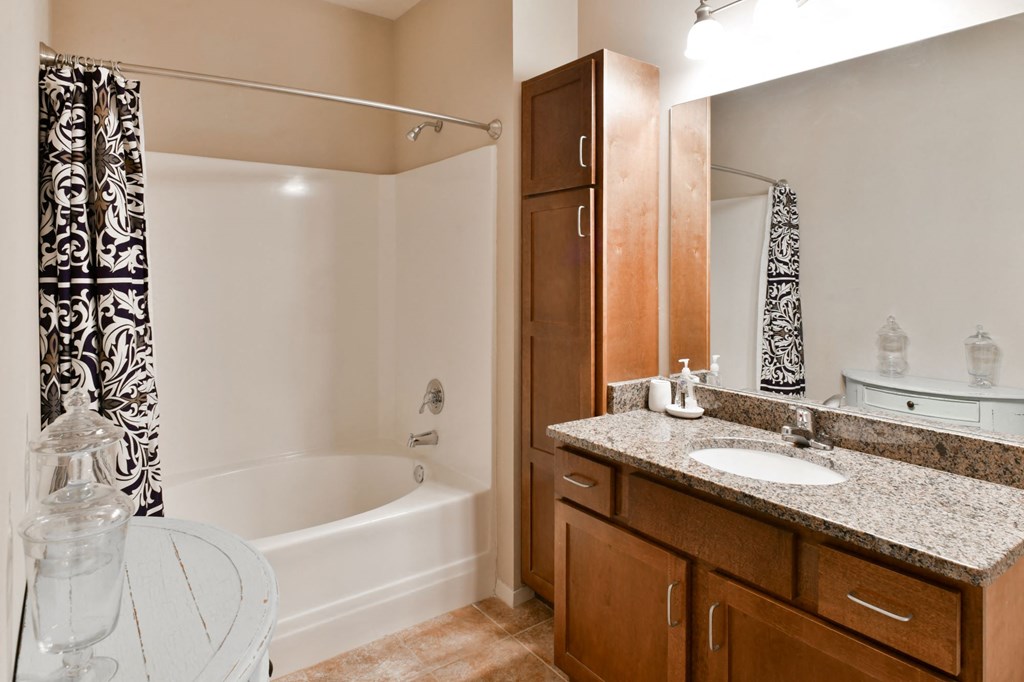 Bathroom with ample storage located at Hall Creek Apts in Arlington, TN 38002