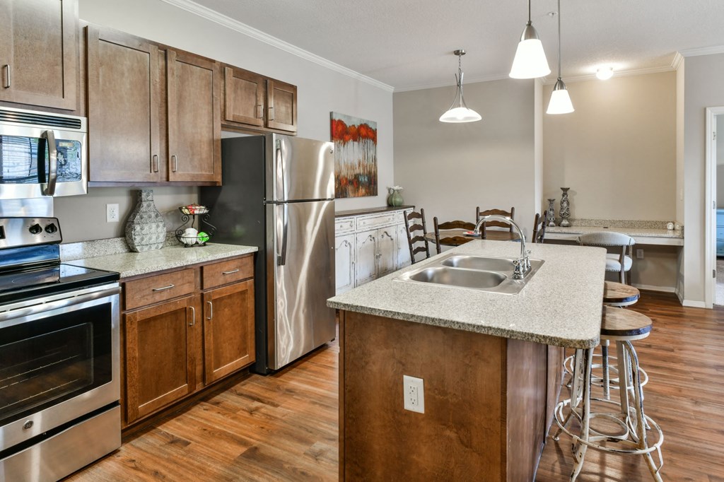 Spacious kitchen with wood cabinets and stainless steel appliances