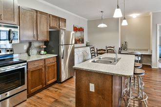Spacious kitchen with wood cabinets and stainless steel appliances