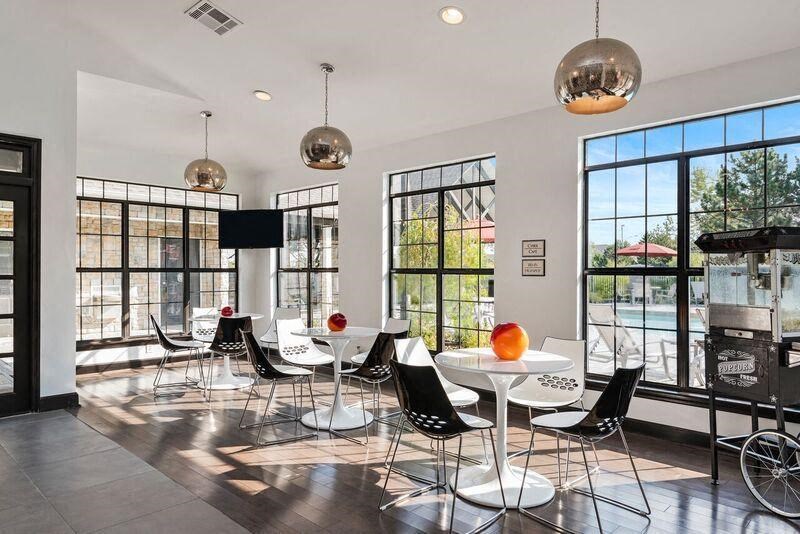 Room full of sunlight through the windows at Sandstone Creek Apartments , Overland Park, KS