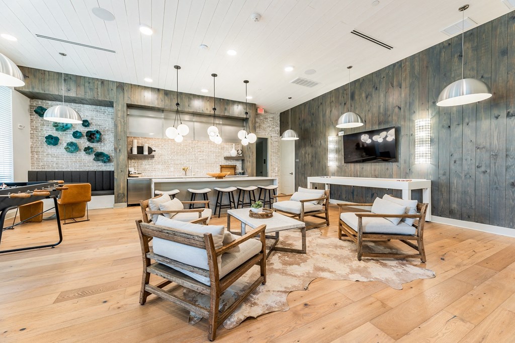 a living room filled with furniture and a flat screen tv  at The Livano Kemah, Kemah, Texas