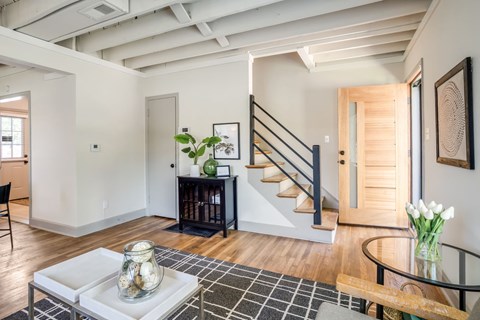 Living Room of a home with a staircase at Kiwi Goji Apartments, Memphis, Tennessee