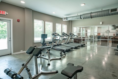 A gym with treadmills, weights, and exercise equipment. at Lakeland Town Square, Tennessee