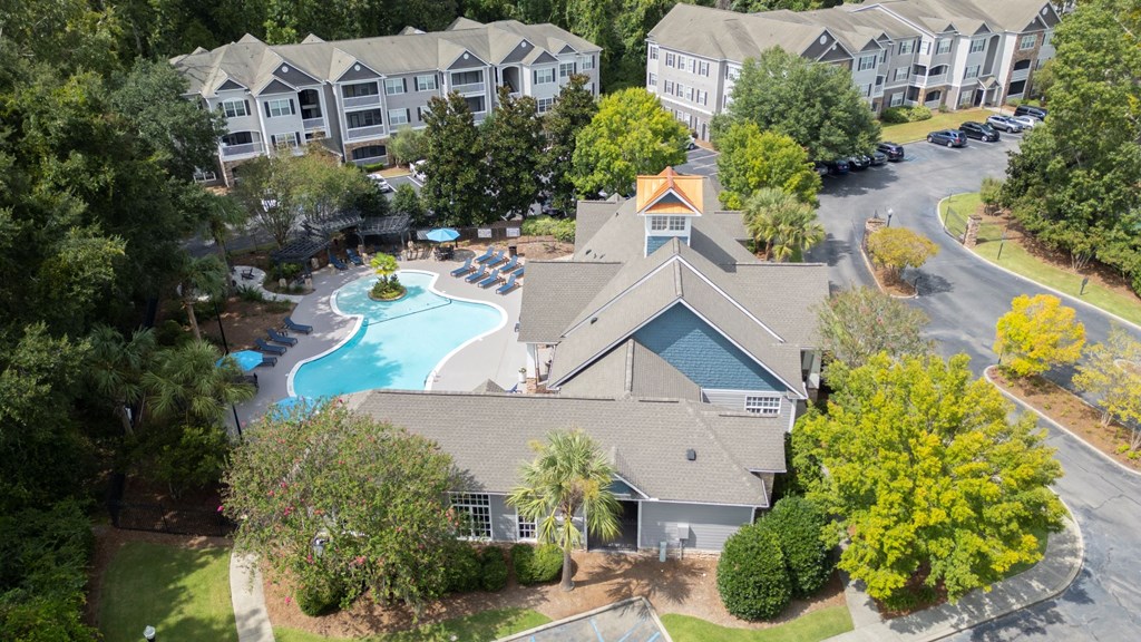 an aerial view of a house with a swimming pool