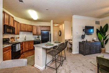 Huge Open Concept Living Space with Elegant Crown Moulding & Chair Railing at Legends at Charleston Park Apartments, North Charleston, SC, 29420