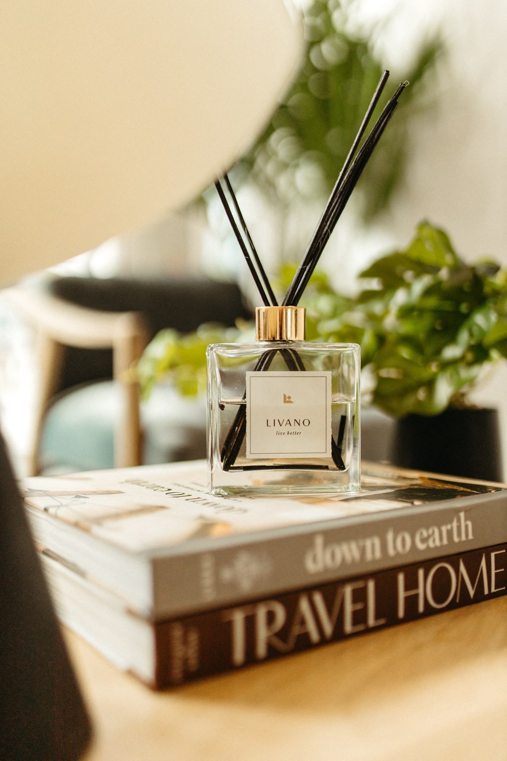 a perfume bottle sitting on top of a stack of books