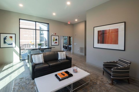 Community lounge with modern seating and artwork at Madison Midtown Apartments, New York, 38104