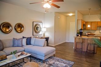 Living Room Come Kitchen View at The Manor Homes of Eagle Glen, Raymore, Missouri - Photo Gallery 3