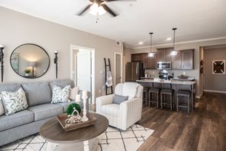 Living room and kitchen at Meridian Park in Collierville, TN 38017 - Photo Gallery 5