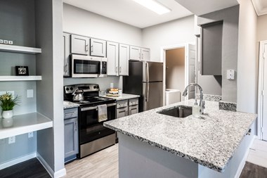 Renovated Kitchen with Laundry Room located at The Moorings Apartments, League City TX 77573