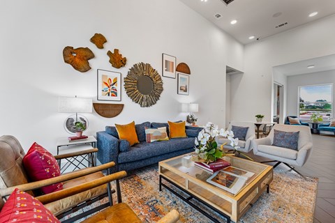 A living room with a blue couch and a coffee table.