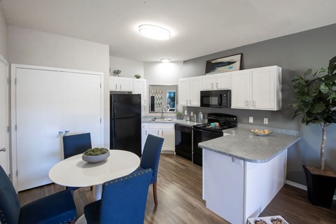 A kitchen with a table and chairs. at Park at Forest Hill Apartments, Memphis, TN, 38125