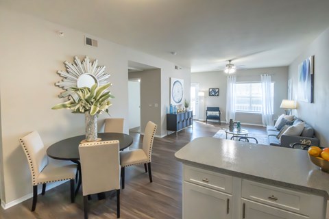 A dining room with a round table and chairs. at Park at Forest Hill Apartments, Memphis, TN, 38125