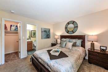 Master bedroom Master Bedroom Feels Large and Spacious with Impressive 9 Foot Ceilings and Large Walk-In Closets at Pointe Royal Townhome Apartments, Overland Park, KS 66213 - Photo Gallery 5