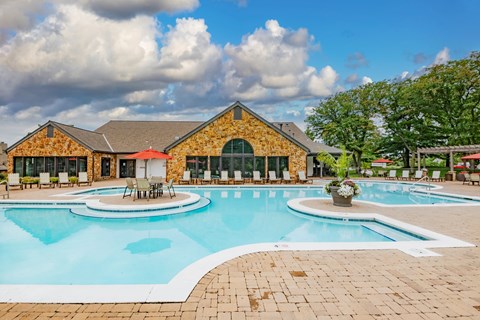 Enjoy our resort-style outdoor swimming pool and chairs at Pointe Royal in Overland Park, KS